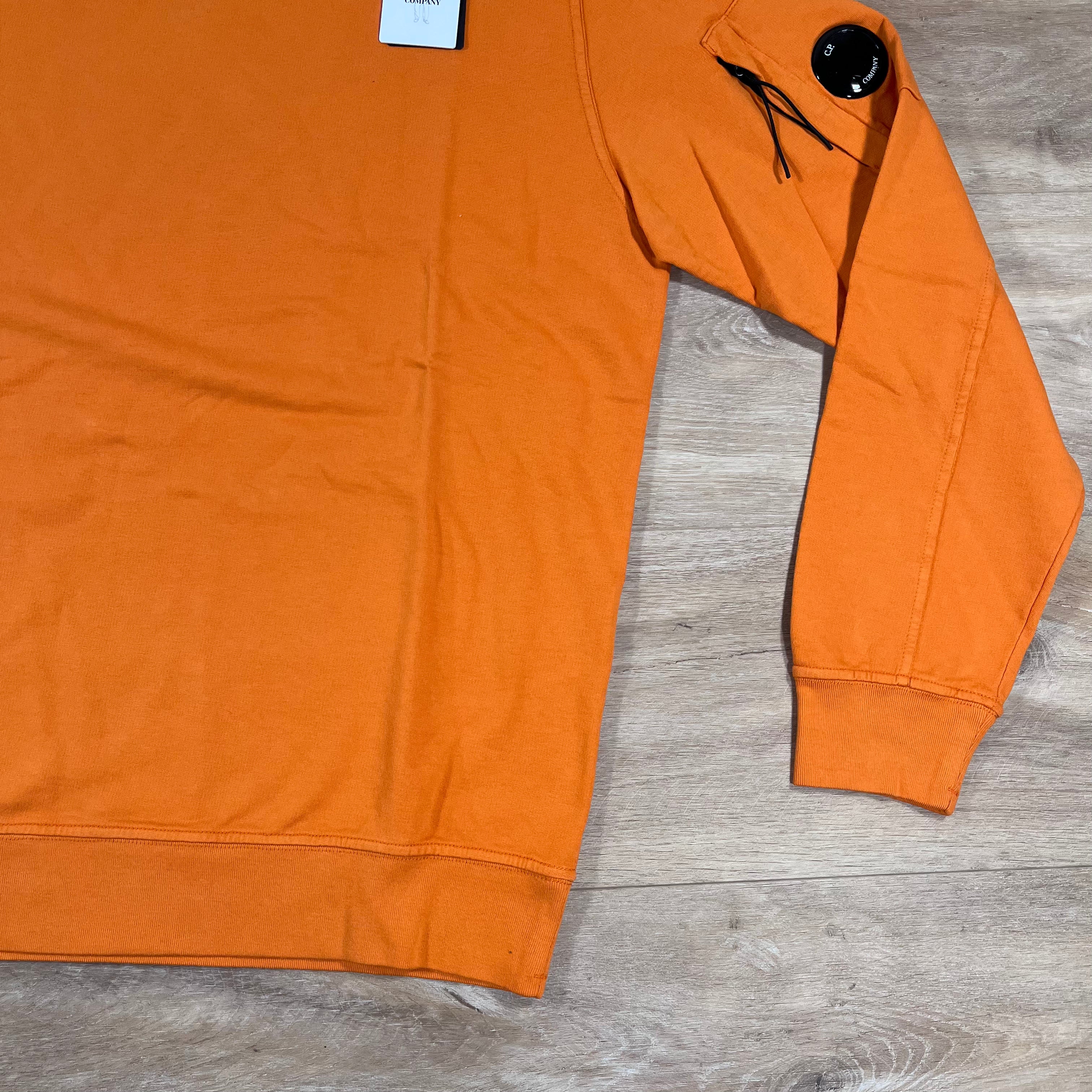 CP Company Light Fleece Crewneck Lens Sweatshirt in Russet Orange