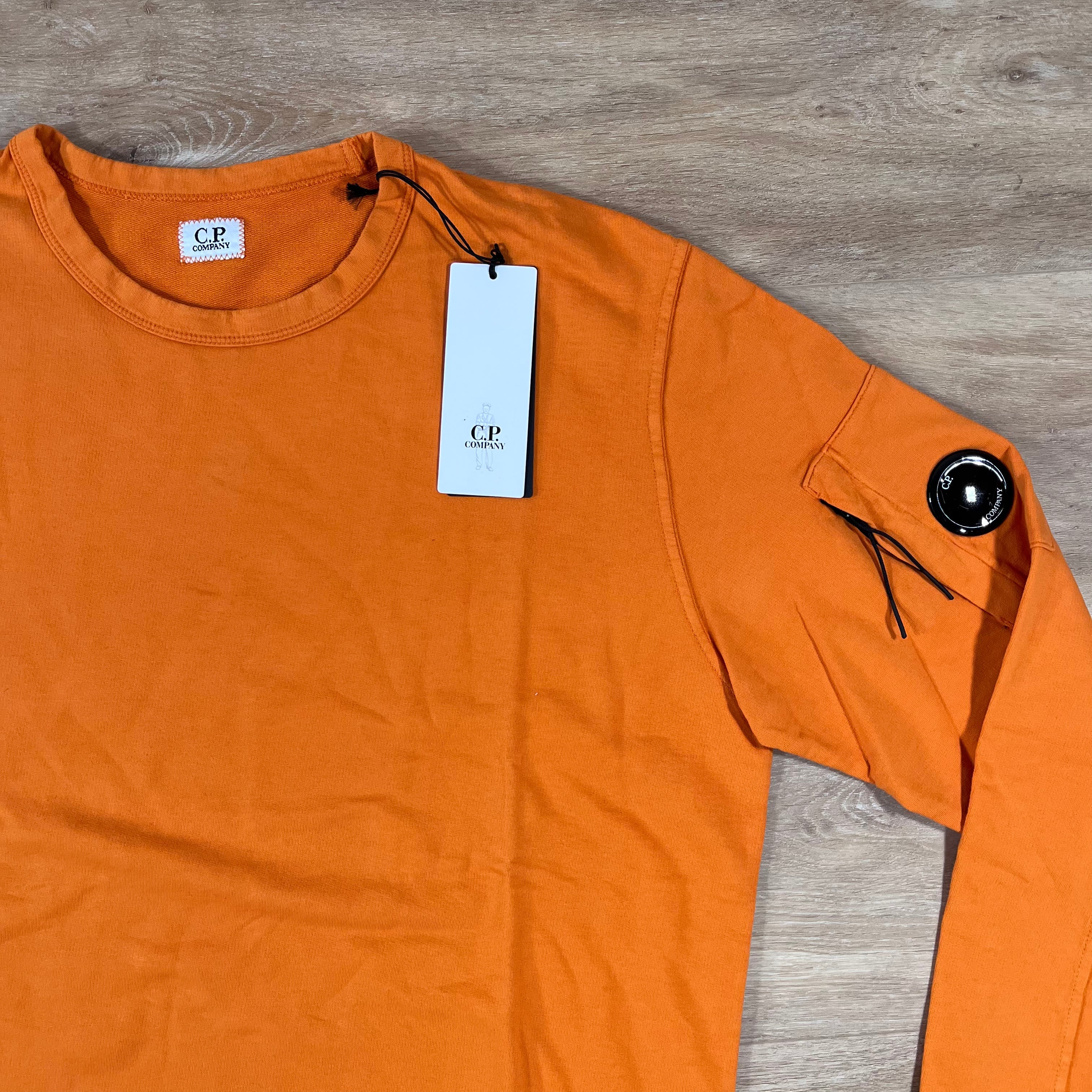 CP Company Light Fleece Crewneck Lens Sweatshirt in Russet Orange